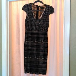 Like new midi length knit black dress with nude lining by Marciano. Size XS.